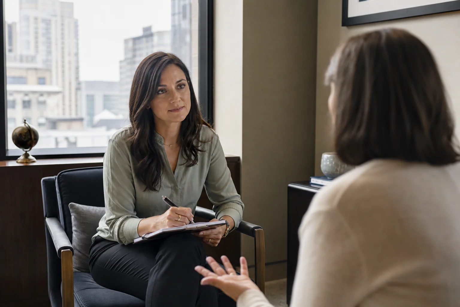 Concerned client discussing an infidelity investigation in a private Manhattan office